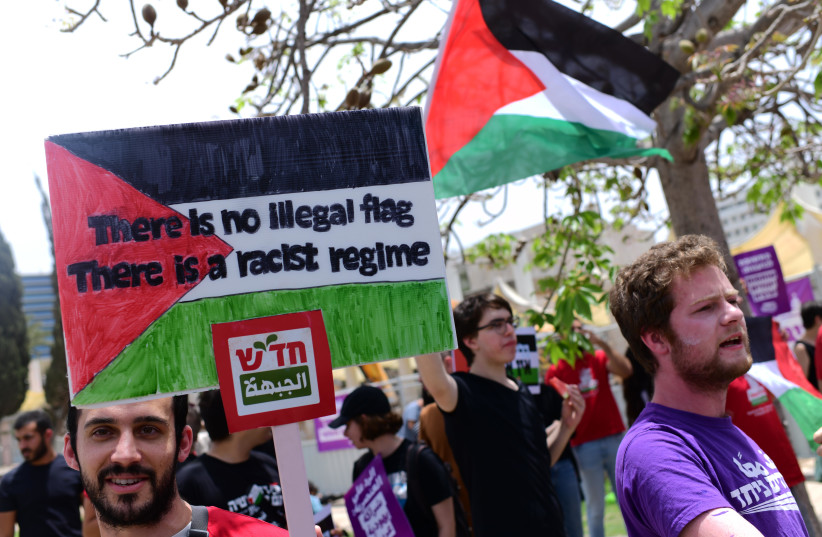  Israeli-Arab students and activists protest against a bill that would ban waving Palestinian flags at Israeli universities, at the Tel Aviv University, May 28, 2023. (photo credit: TOMER NEUBERG/FLASH90)