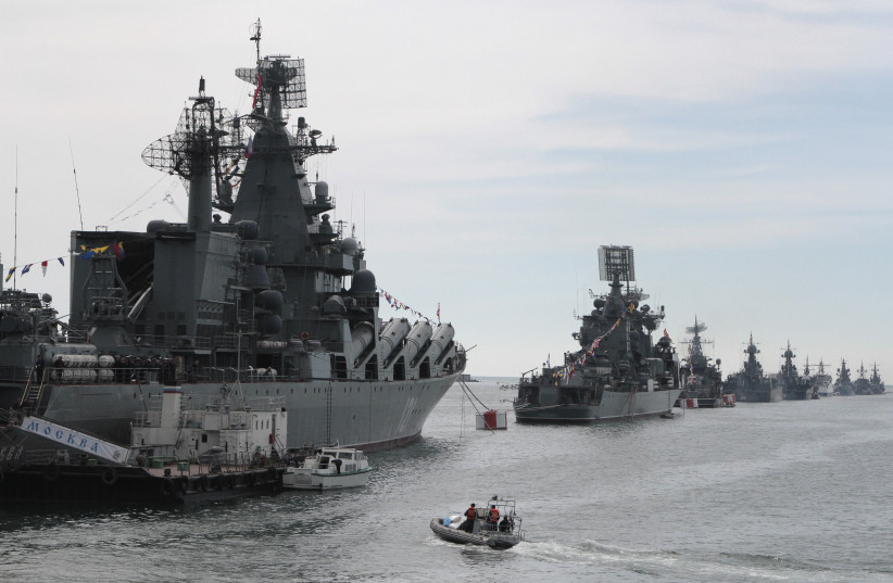  Russian Navy vessels are anchored in a bay of the Black Sea port of Sevastopol in Crimea May 8, 2014. Russian servicemen and sailors will conduct a parade to mark Victory Day on May 9, according to local media. (photo credit: STRINGER/ REUTERS)