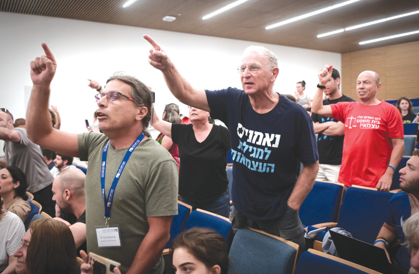 PROTESTERS DISRUPT an event taking place with Knesset Constitution, Law and Justice Committee Chairman Simcha Rothman, in Tel Aviv, on Sunday. Their demands included calls for an independent court. (photo credit: AVSHALOM SASSONI/FLASH90)