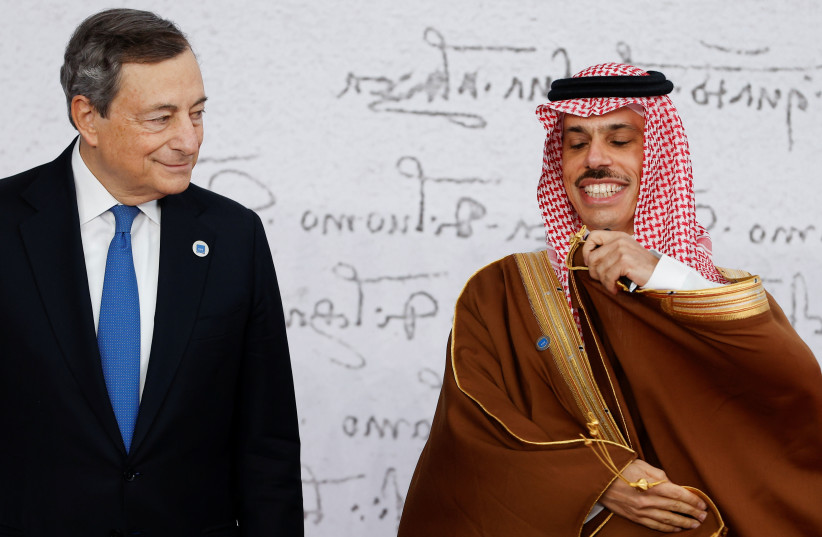 talian Prime Minister Mario Draghi poses with Saudi Arabia's Foreign Minister H.H. Prince Faisal bin Farhan al Saud as he arrives for the G20 leaders summit in Rome, Italy October 30, 2021 (photo credit: REUTERS/GUGLIELMO MANGIAPANE)