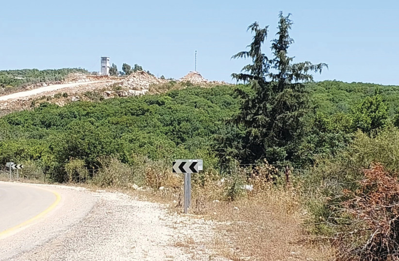  A WHITE Hezbollah watchtower just a few meters from where the IDF is constructing a wall on the border with Lebanon, near Zar’it. (photo credit: HERB KEINON)