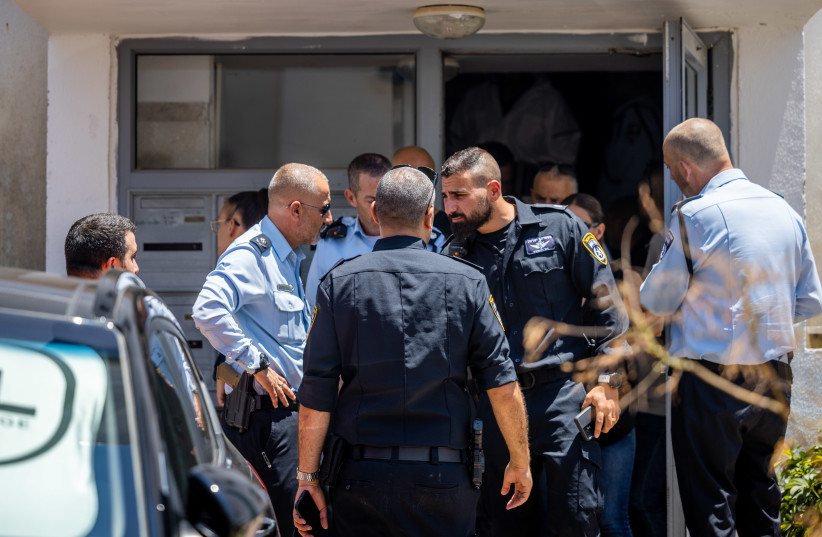  Police and paramedics at a crime scene in Beit Shemesh on July 23, 2022 (photo credit: YONATAN SINDEL/FLASH90)