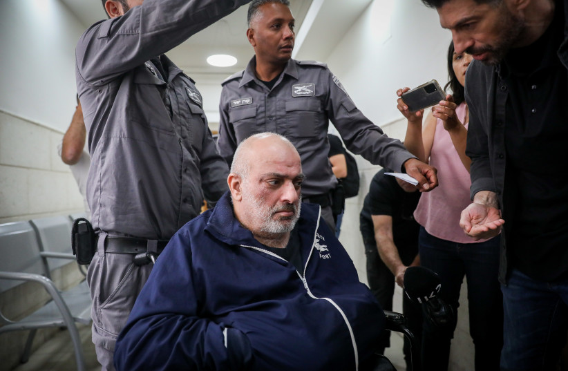  Yitzhak Sharifi is brought for a court hearing sentence at the Jerusalem District court, on May 30, 2023. Photo by Flash90 (photo credit: FLASH90)