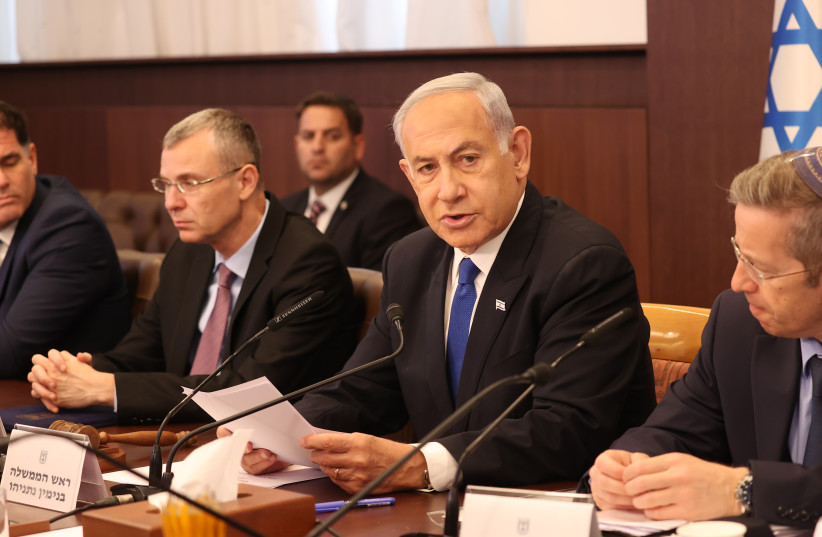  Prime Minister Benjamin Netanyahu leads the government's weekly government meeting. (photo credit: AMIT SHABI/POOL)