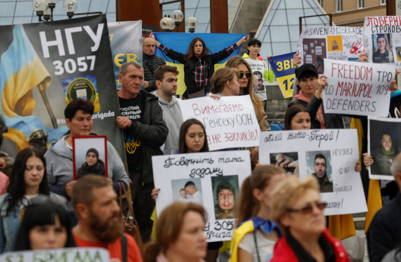  Relatives of Ukrainian prisoners of war (POWs) attend a rally demanding to speed up their release from a Russian captivity, amid Russia's attack on Ukraine, at the Independence Square in Kyiv, Ukraine October 1, 2022. (photo credit: REUTERS/VALENTYN OGIRENKO)