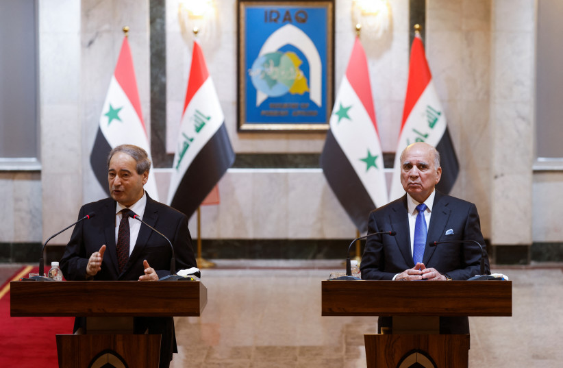  Syrian Foreign Minister Faisal Mekdad and his Iraqi counterpart Fuad Hussein attend a joint press conference, in Baghdad, Iraq June 4, 2023. (photo credit: AHMED SAAD/REUTERS)