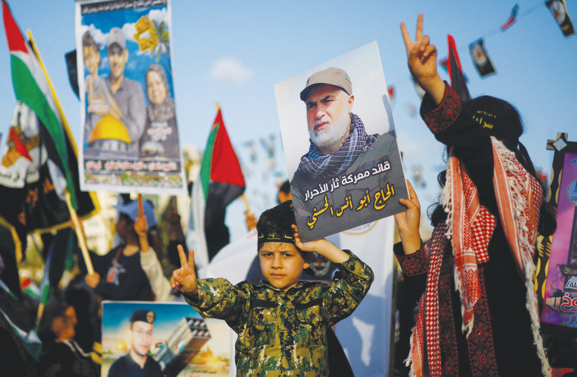  ISLAMIC JIHAD commemorates leaders killed by Israel in Gaza last month. It’s important to begin delegitimizing the war crimes of Gazan terror factions and to counter the trend of normalizing such actions, says the writer. (photo credit: MOHAMMED SALEM/REUTERS)