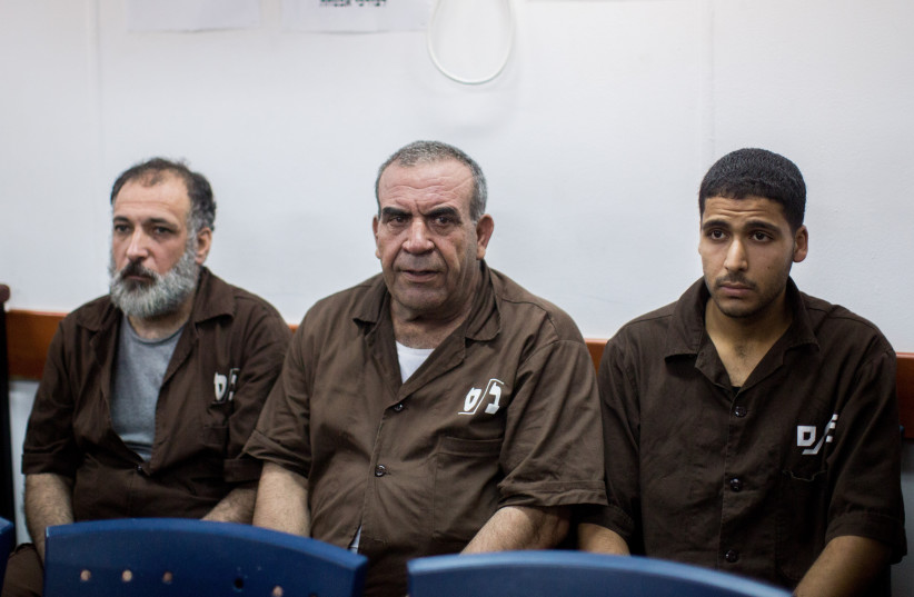  The group of terrorists who involved in the terror attack near Shvut Rachel on June 29, where Malachi Rosenfeld was murdered is seen at the Israel's Ofer military court near the West Bank city of Ramallah on August 17, 2015.  (photo credit: YONATAN SINDEL/FLASH90)