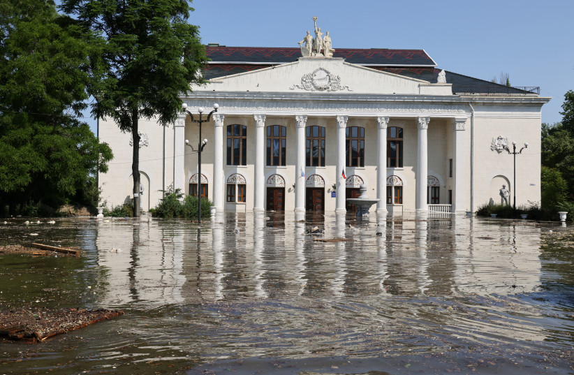  A view shows the House of Culture on a flooded street in Nova Kakhovka after the nearby dam was breached in the course of Russia-Ukraine conflict, in the Kherson Region, Russian-controlled Ukraine, June 6, 2023. (photo credit: ALEXEY KONOVALOV/TASS/Handout via Reuters)