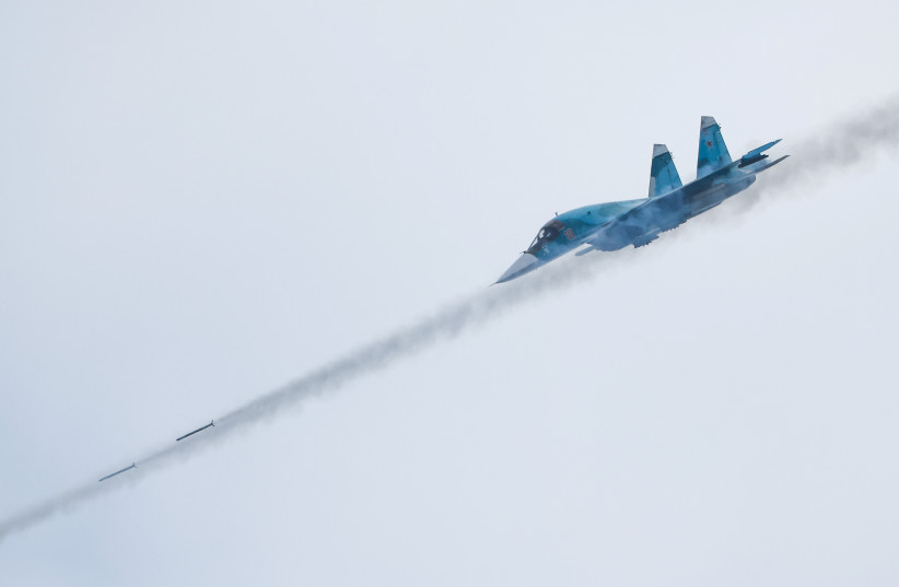  A Russian Sukhoi Su-34 fighter-bomber fires missiles during the Aviadarts competition, as part of the International Army Games 2021, at the Dubrovichi range outside Ryazan, Russia August 27, 2021. (photo credit: MAXIM SHEMETOV/REUTERS)