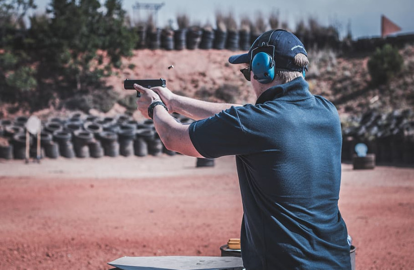  Illustrative image of a man at a shooting range. (photo credit: WALLPAPER FLARE)