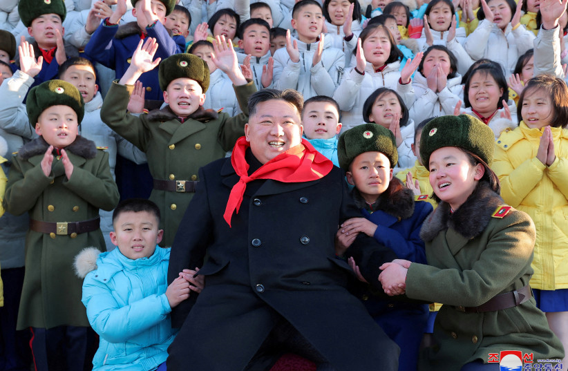  North Korean leader Kim Jong Un poses for a group photo with representatives of the Korean Children's Union (KCU) under North Korea's ruling Workers' Party in Pyongyang, North Korea (photo credit: REUTERS)