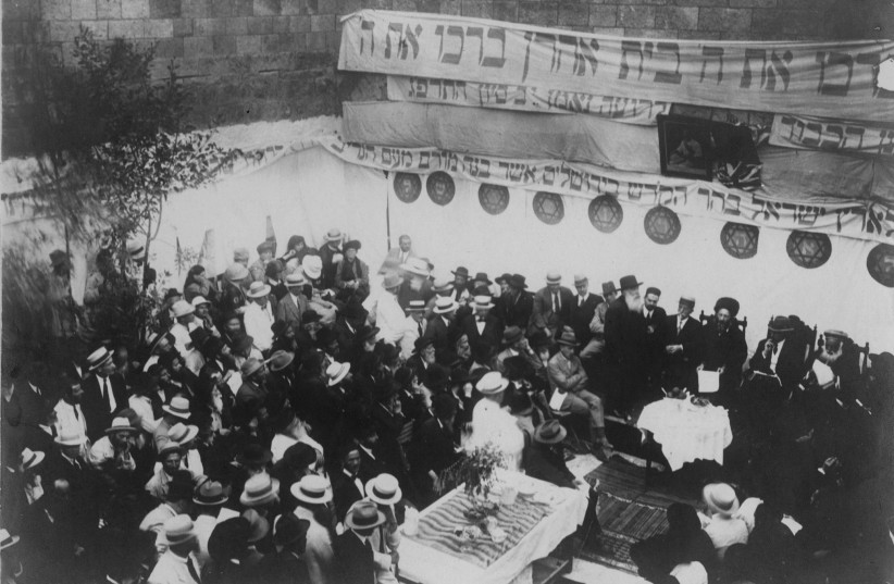  BEIT HARAV dedication ceremony a century ago, on 12 Sivan, 5683 / May 27, 1923. Seated on the dais is Rav Abraham Isaac Kook wearing his fur spodek; to his L are Harry Fischel, Herbert Samuel, and Sephardi chief rabbi Yaakov Meir.  (photo credit: Courtesy Rabbi Aaron I. Reichel, Esq., administrator, Harry and Jane Fischel Foundation)