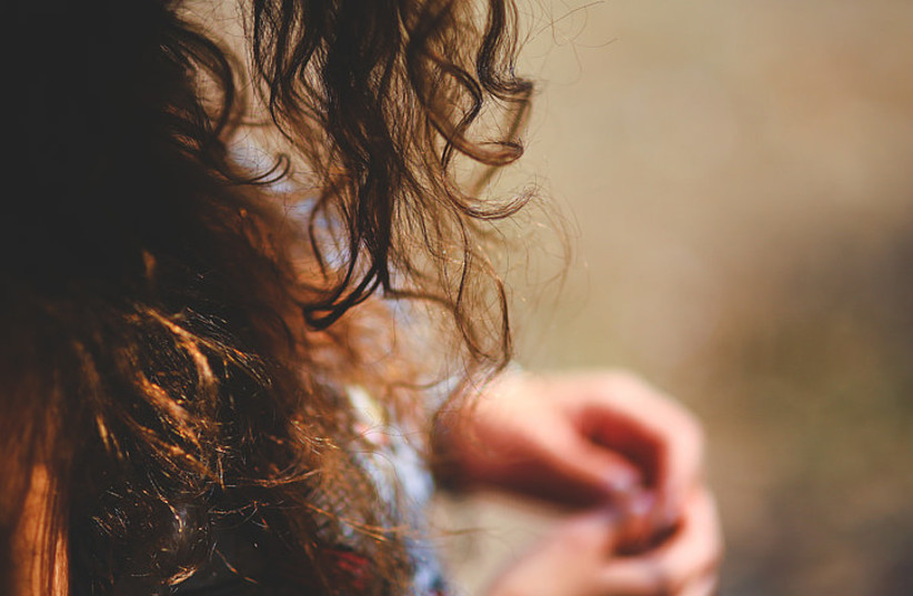  Woman with long, curly, brown hair. (photo credit: PICKPIK)