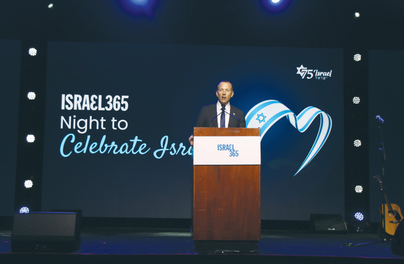  THE WRITER speaks to a Christian Zionist audience last month at the Israel365 Night to Celebrate Israel, in Orlando, Florida.  (photo credit: Bryan Seltzer/IPA News/Courtesy, Tuly Weisz)