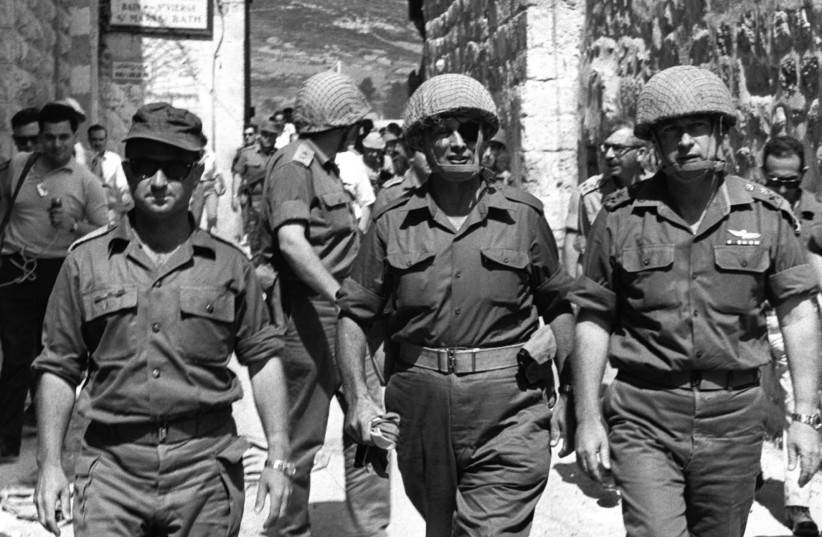  FROM LEFT: Central Command head Uzi Narkiss, defense minister Moshe Dayan and IDF chief of staff Yitzhak Rabin walk through the Lions’ Gate into Jerusalem’s Old City in June 1967.  (photo credit: ILAN BRUNER/GPO)