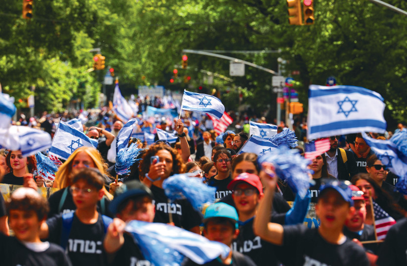  YOUTH ARE among the masses taking part in the Celebrate Israel Parade in New York City last Sunday. (photo credit: Amr Alfiky/Reuters)
