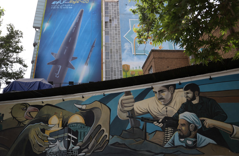 A billboard with a photo of a new hypersonic ballistic missile called "Fattah" and with text reading "400 seconds to Tel Aviv" is seen on a building in Tehran, Iran June 8, 2023. (photo credit: Majid Asgaripour/West Asia News Agency/Reuters)