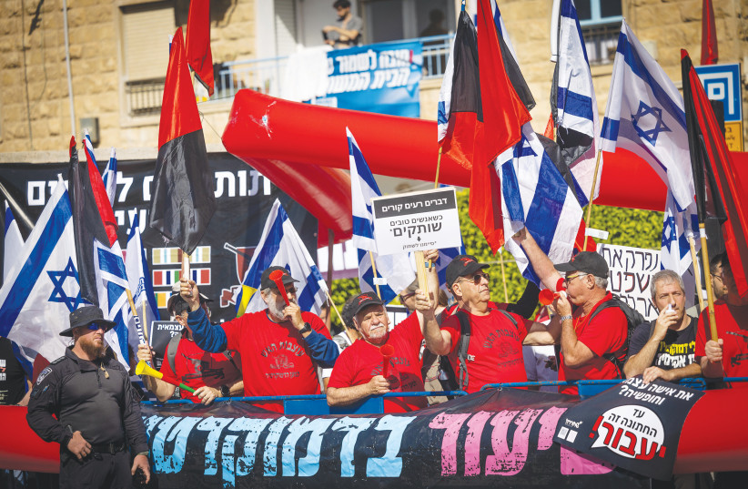  A DEMONSTRATION against the government’s planned judicial overhaul takes place across from the President’s Residence in Jerusalem, last month. The large black banner at the bottom reads: ‘Lesson in democracy.’  (photo credit: YONATAN SINDEL/FLASH90)