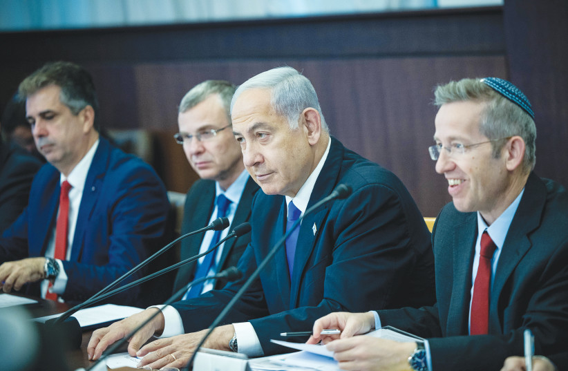  PRIME MINISTER Benjamin Netanyahu has surrounded himself with ministers and assistants who appear to serve only one purpose, enabling him to survive politically, the writer maintains. (photo credit: YONATAN SINDEL/FLASH90)