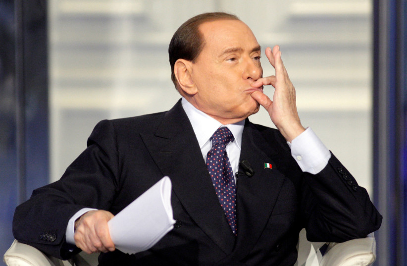  Italy's former Prime Minister Silvio Berlusconi gestures as he appears as a guest on the RAI television show Porta a Porta (Door to Door) in Rome, Italy, January 9, 2013. (photo credit: REMO CASSILI/REUTERS)