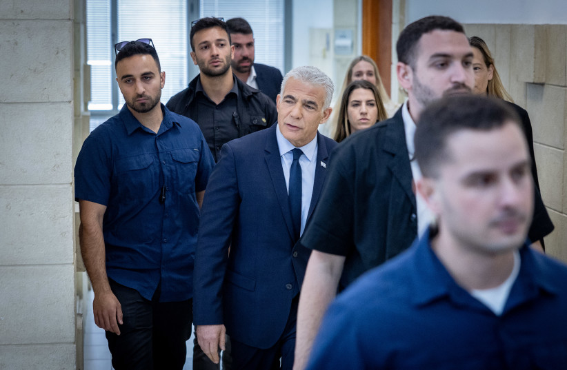  Head of opposition Yair Lapid arrives to testify in the trial against Israeli prime minister Benjamin Netanyahu at the District Court in Jerusalem on June 12, 2023. (photo credit: YONATAN SINDEL/FLASH90)