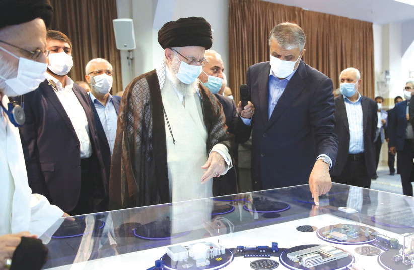  IRAN’S SUPREME Leader Ayatollah Ali Khamenei views a model of a nuclear facility in Tehran on Sunday.  (photo credit: Office of the Iranian Supreme Leader/West Asia News Agency/Reuters)