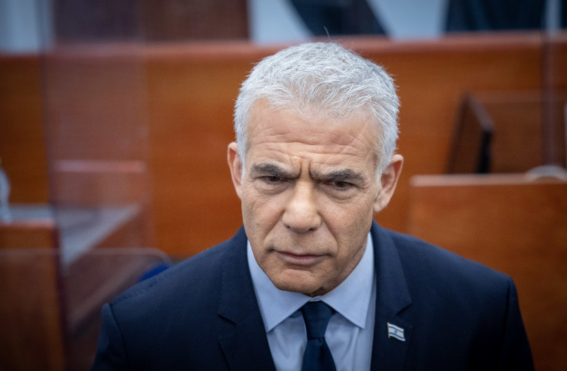  Opposition head Yair Lapid arrives to testify in the trial against Israeli prime minister Benjamin Netanyahu at the District Court in Jerusalem on June 12, 2023 (photo credit: YONATAN SINDEL/FLASH90)