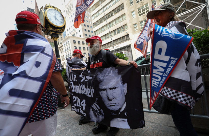 Supporters of former US president Donald Trump gather outside Trump Tower, ahead of his appearance in federal court in Miami, Florida, to be arraigned on 37 criminal charges, in Manhattan in New York City, New York, US, June 13, 2023 (photo credit: REUTERS/MIKE SEGAR)