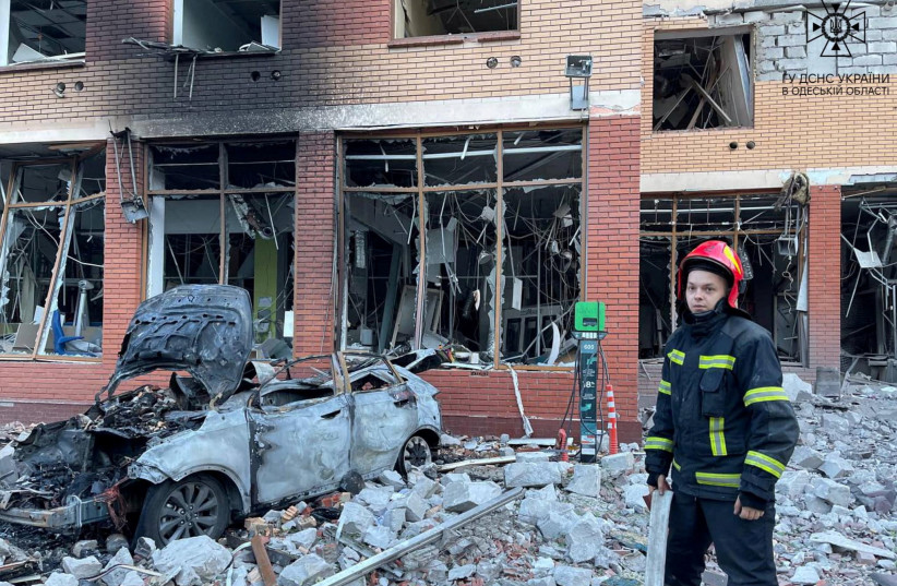  A firefighter is seen at a site of an office building damaged by a Russian missile strike, amid Russia's attack on Ukraine, in Odesa, Ukraine June 14, 2023. (photo credit: Press service of the State Emergency Service of Ukraine/Handout via REUTERS)