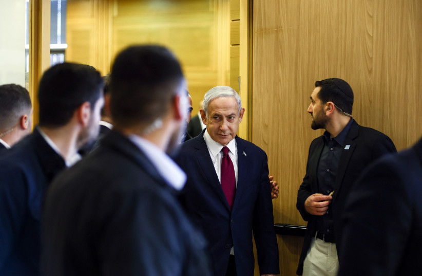  Israeli Prime Minister Benjamin Netanyahu leaves his Likud party faction meeting at the Knesset, Israel's parliament, in Jerusalem, June 14, 2023. (photo credit: RONEN ZVULUN/REUTERS)