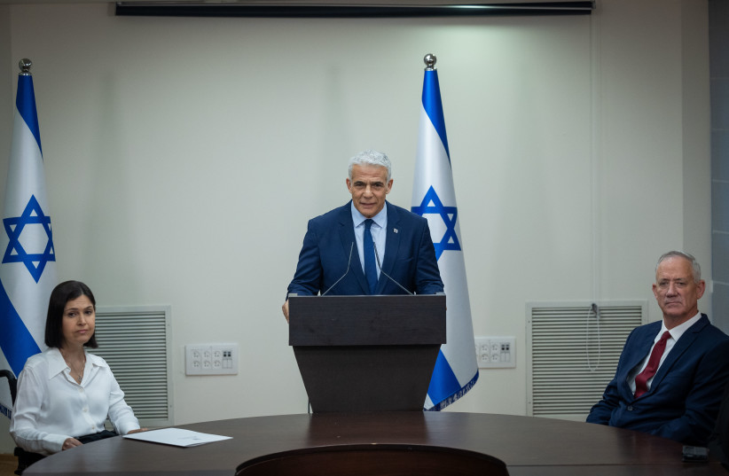  Yesh Atid head Yair Lapid, National Unity head Benny Gantz and MK Karine Elharrar hold a joint press conference in the Israeli parliament, Jeursalem, on June 14, 2023 (photo credit: YONATAN SINDEL/FLASH90)