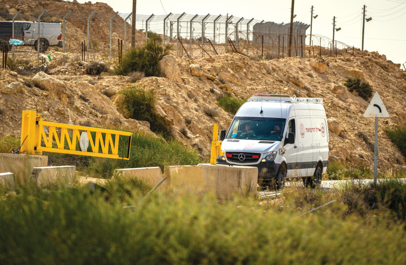  An IDF medical vehicle drives near the Israeli-Egyptian border after three IDF soldiers were killed in the area earlier this month. (photo credit: FLASH90)
