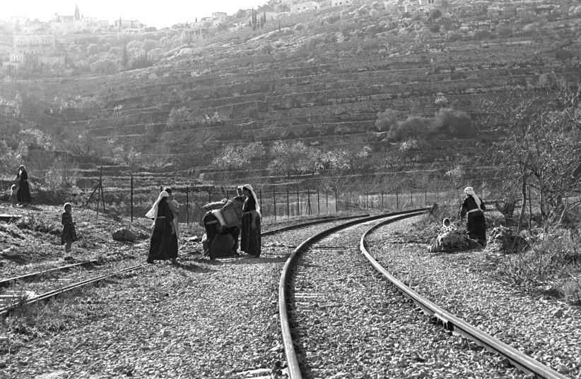  Palestinian women from Battir collect wood and herbs along the Tel Aviv-Jerusalem railway line near the village in 1967. (photo credit: Moshe Milner/GPO)