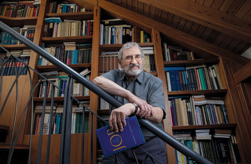  Prof. Ed Greenstein holding his book, ‘Job’ (photo credit: David Salem/Zoog Productions)
