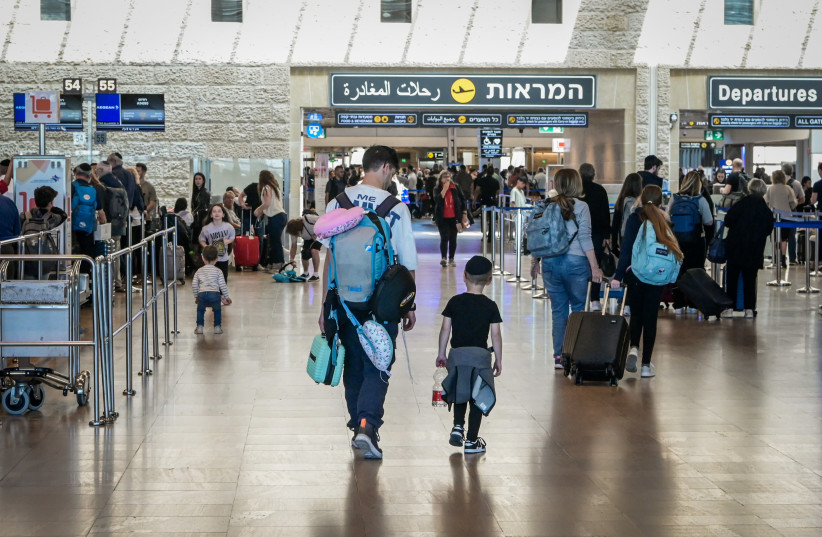  Travelers are seen at the departure hall of the Ben Gurion International Airport on April 4, 2023 (photo credit: AVSHALOM SASSONI/FLASH90)