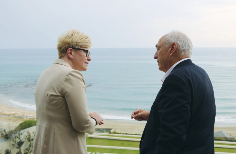 LITHUANIAN PRIME MINISTER Ingrida Simonyte and Chemi Peres, chairman of the Peres Center for Peace and Innovation, chat as they overlook the sea directly below the Peres Center in Jaffa. (photo credit: COURTESY PERES CENTER)