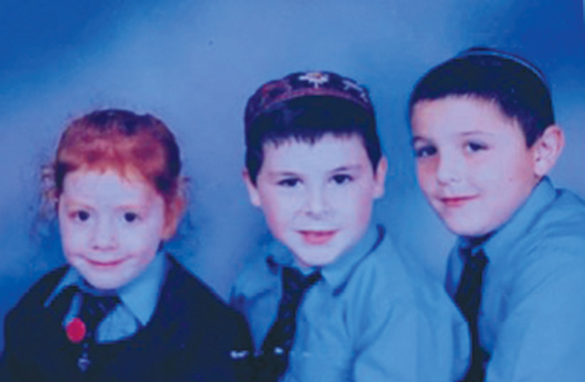  THE WRITER’S three children wear their uniforms during school days in Manchester. (photo credit: ANDREA SAMUELS)