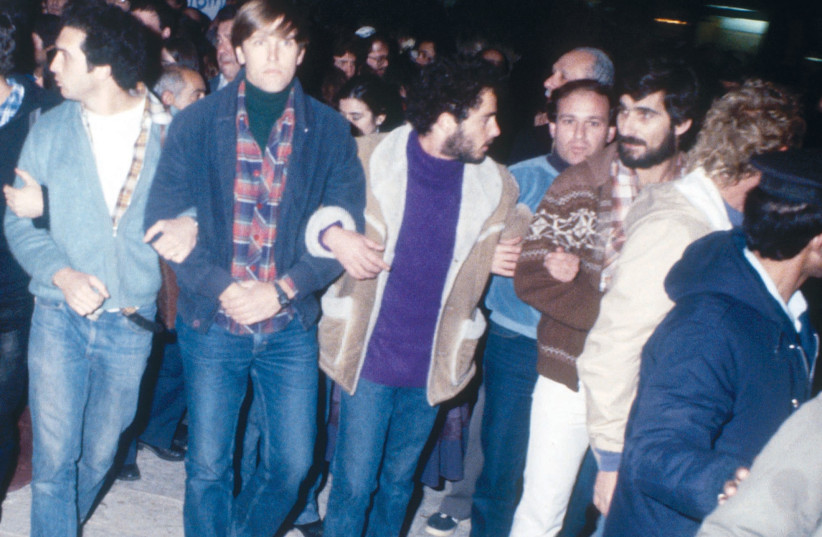  EMIL GRUNZWEIG, fourth from left, attends a protest against the war in Lebanon, across from the Prime Minister’s Office in Jerusalem, on February 10, 1983. Soon after, he was killed when a grenade was thrown by a counter-demonstrator. (photo credit: YOSSI ZAMIR/FLASH90)