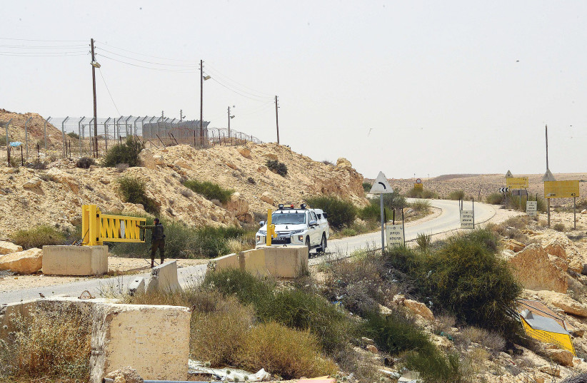  IDF AND rescue forces are seen close to the border with Egypt, on June 3, after three Israeli soldiers were killed there by an Egyptian policeman.  (photo credit: FLASH90)
