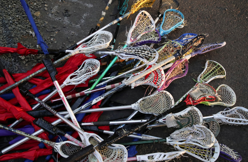 A pile of Lacrosse sticks with umbrellas attached to the ends is pictured during a protest against racial inequality and police violence in Portland, Oregon, U.S., July 30, 2020. (photo credit: REUTERS/CAITLIN OCHS)