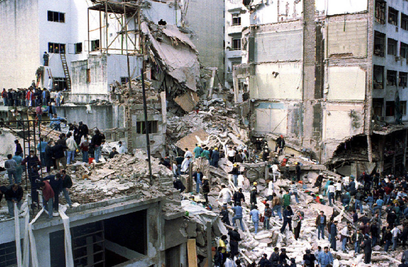  Rescue workers search for survivors and victims in the rubble left after a powerful car bomb destroyed the Buenos Aires headquarters of the Argentine Israeli Mutual Association (AMIA), in this July 18, 1994 file photo (photo credit: REUTERS/Enrique Marcarian RR/ME)