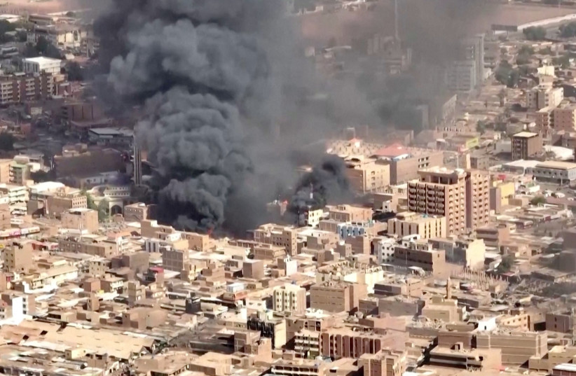  An aerial view of the black smoke and flames at a market in Omdurman, Khartoum North, Sudan, May 17, 2023 in this screengrab obtained from a handout video. (photo credit: VIDEO OBTAINED BY REUTERS/Handout via REUTERS)