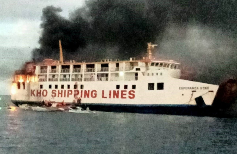  Smoke rises due to a massive fire at a ferry in Bohol, Philippines, June 18, 2023 in this handout image.  (photo credit: PHILIPPINE COAST GUARD/HANDOUT VIA REUTERS)