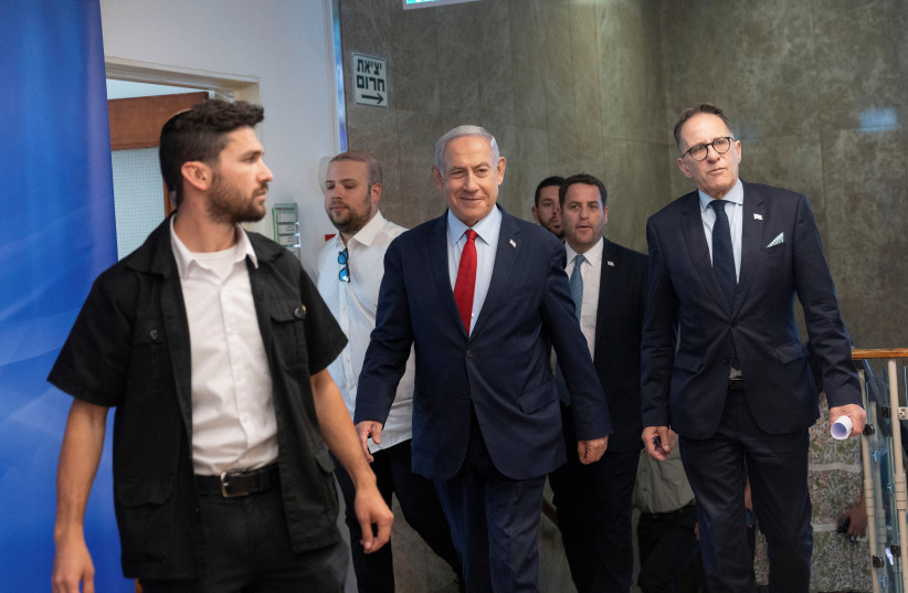 Israeli Prime Minister Benjamin Netanyahu, center, arrives to chair a cabinet meeting at the prime minister's office in Jerusalem, June 18, 2023. (photo credit: Ohad Zwigenberg/Pool via REUTERS)