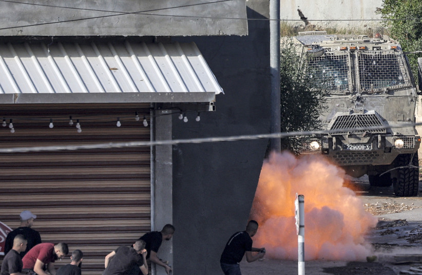  An explosive charge left by Palestinians detonates before an Israeli armoured vehicle during an Israeli army raid in Jenin in the West Bank on June 19, 2023. (photo credit: JAAFAR ASHTIYEH/AFP via Getty Images)