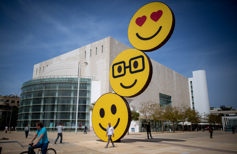"Smiley"'s posted on a sculpture on ha Bima square in Tel Aviv. March 19, 2016. (photo credit: MIRIAM ALSTER/FLASH90)