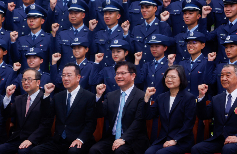  Taiwan's President Tsai Ing-wen poses for photos with students during their graduation ceremony at the National Defense University in Taipei, Taiwan June 21, 2023.  (photo credit: ANN WANG/REUTERS)
