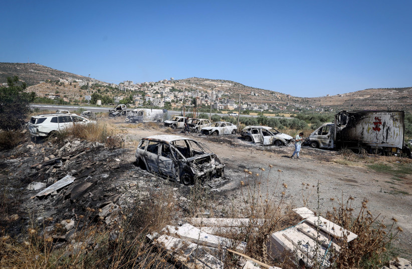  Burned cars in the West Bank village of Al-Lubban, next to the Israeli settlement of Eli. According to Al-Lubban village residents, Israeli settlers attacked the village and burned a gas station and several cars, a day after a terror attack near the Israeli settlement of Eli. (photo credit: FLASH90)