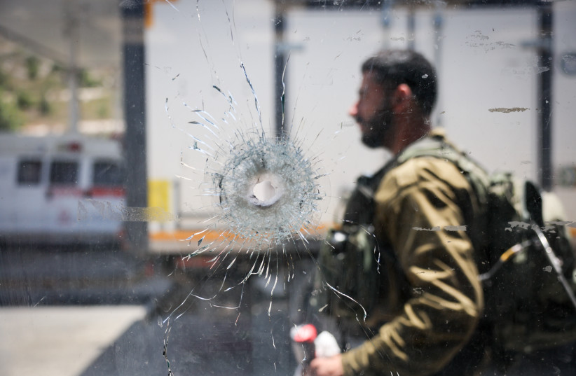 The scene of a deadly shooting attack near the Jewish Settlement of Eli, West Bank, June 21, 2023 (photo credit: YONATAN SINDEL/FLASH90)